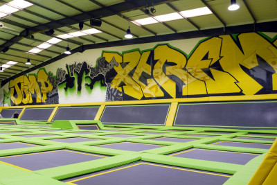 Trampoline park with graffiti wall by Soulful Creative