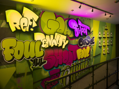 Stairwell wall covered in bubble-letter graffiti reading 